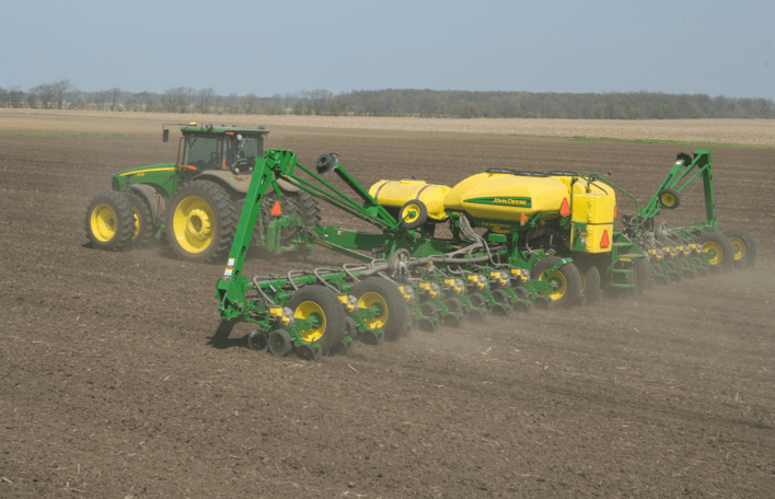 Machinery plowing land