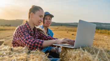 Two women looking at a laptop